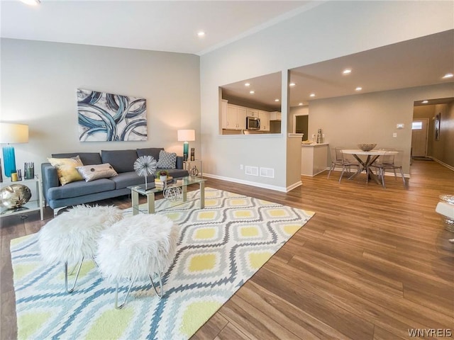 202 Carriage Ln, West Seneca, NY 14224 - living area with wood finished floors, baseboards, and recessed lighting