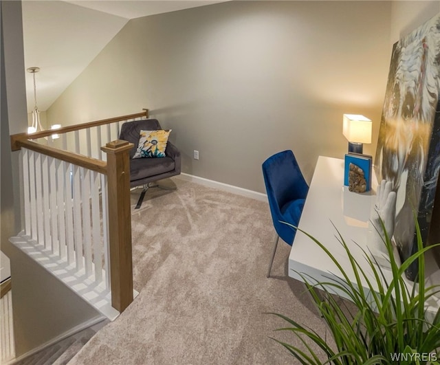 carpeted office space featuring lofted ceiling