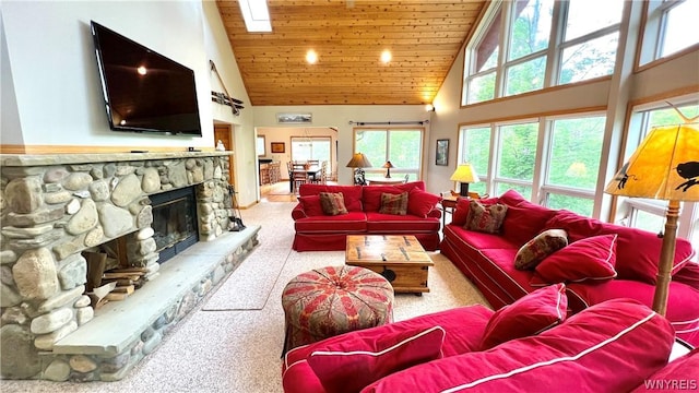 carpeted living room with wooden ceiling, a fireplace, and high vaulted ceiling