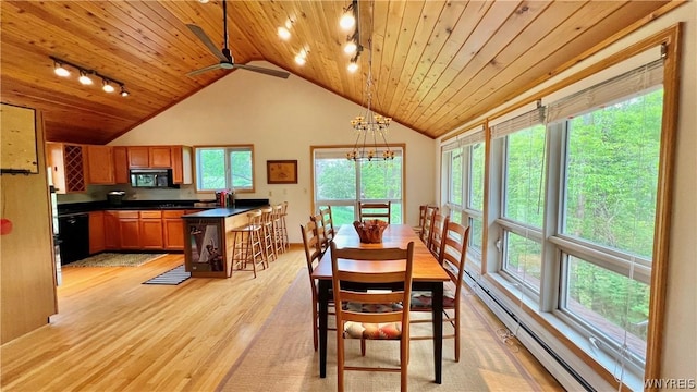 dining space featuring a wealth of natural light, track lighting, and light wood-type flooring