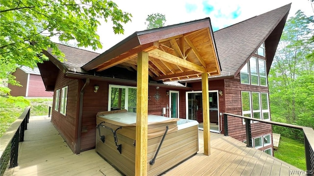 deck featuring a hot tub