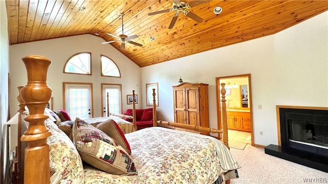 carpeted bedroom with ceiling fan, ensuite bathroom, high vaulted ceiling, and wooden ceiling