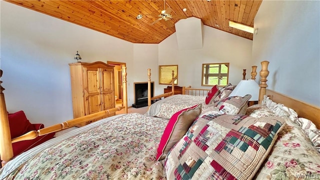 bedroom featuring a skylight, high vaulted ceiling, and wooden ceiling