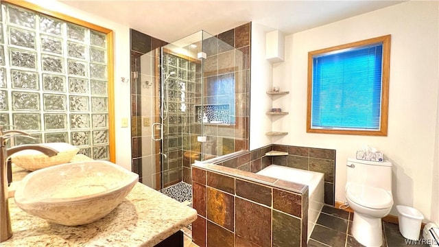 bathroom with vanity, a baseboard heating unit, tile patterned flooring, toilet, and a shower with shower door