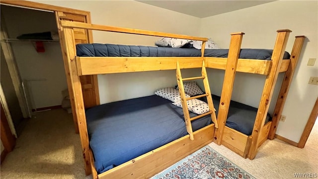 carpeted bedroom featuring a closet