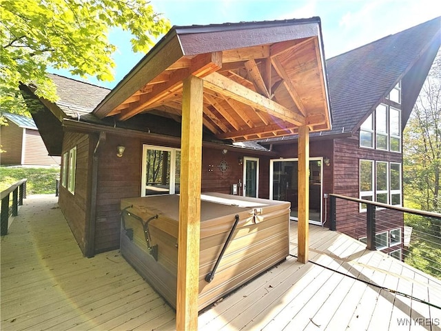 deck featuring a hot tub