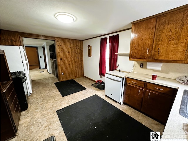 kitchen with black range with gas cooktop, light tile flooring, and refrigerator