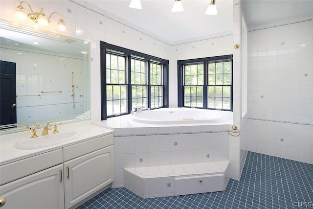 bathroom featuring tile patterned flooring, vanity, and tile walls