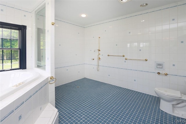 bathroom with tile patterned floors, toilet, tile walls, and walk in shower