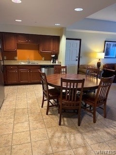 dining room with sink and light tile flooring