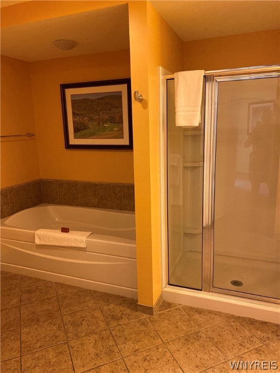 bathroom featuring tile flooring and plus walk in shower