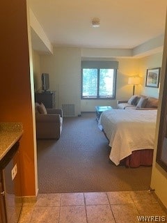 bedroom with light tile flooring