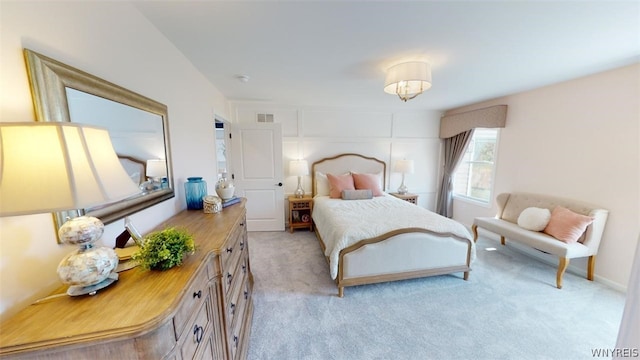 bedroom featuring light colored carpet