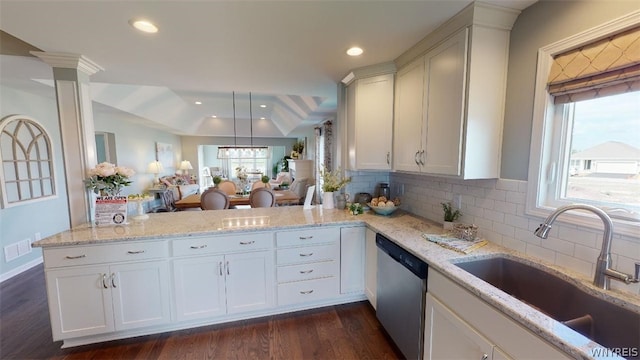 6684 Curtis Ct, Lockport-Town, NY 14094 - kitchen with stainless steel dishwasher, a sink, dark wood-type flooring, decorative backsplash, and light stone countertops