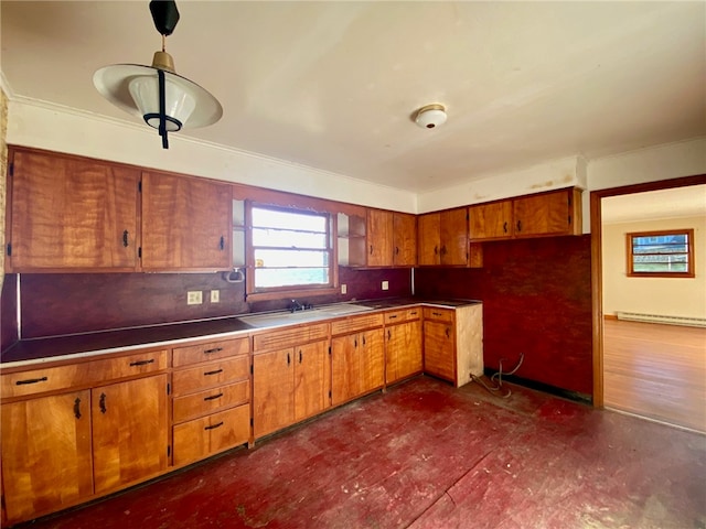 kitchen featuring hanging light fixtures, sink, tasteful backsplash, baseboard heating, and dark hardwood / wood-style floors