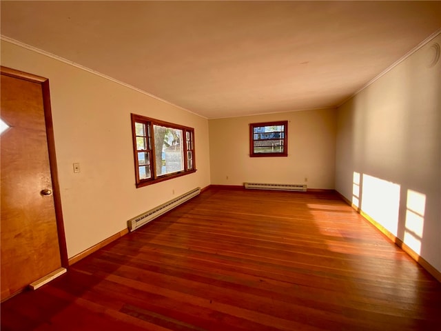 empty room with crown molding, a baseboard radiator, and wood-type flooring