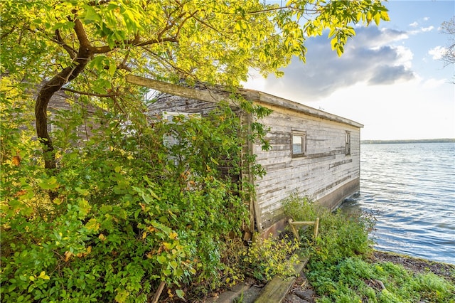 view of side of property with a water view