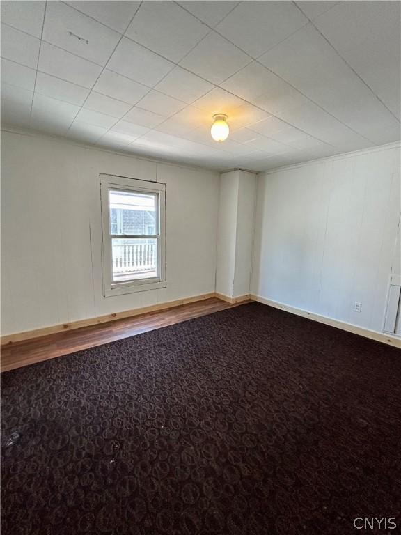 919 Lenox Ave, Utica, NY 13502 - carpeted spare room with baseboards
