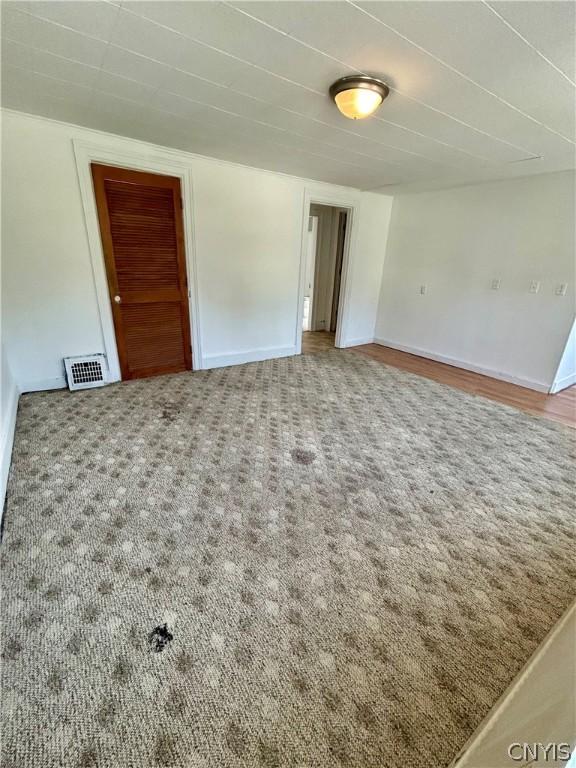 919 Lenox Ave, Utica, NY 13502 - unfurnished room featuring carpet flooring, baseboards, and visible vents