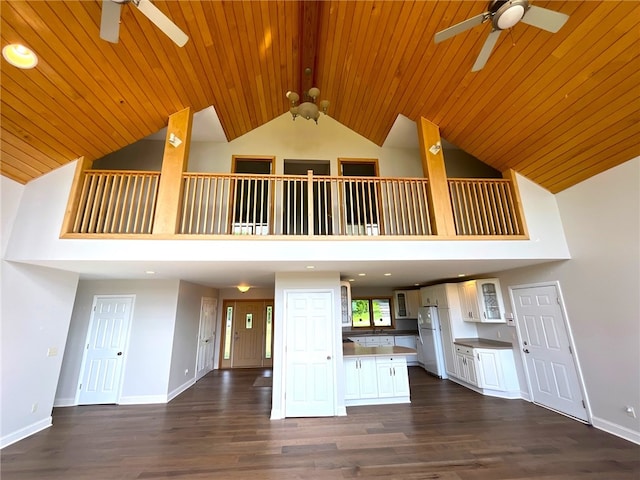 kitchen featuring high vaulted ceiling, white cabinets, white refrigerator, dark hardwood / wood-style floors, and wood ceiling