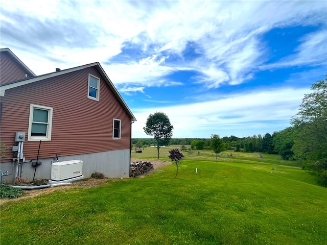 view of side of property with a yard