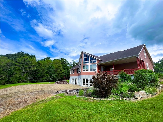 1234 Overhiser Rd, Hanover, NY 14062 - back of house with driveway, a lawn, and an attached garage