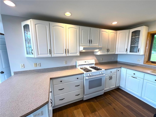 kitchen featuring white gas stove, white cabinets, and dark hardwood / wood-style floors