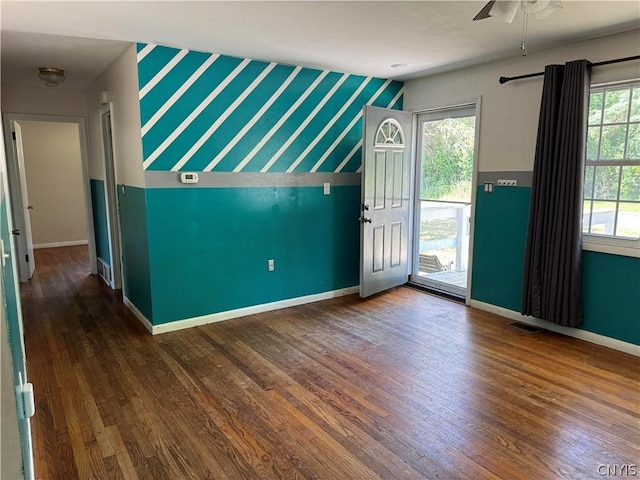 interior space featuring lofted ceiling, dark hardwood / wood-style floors, and ceiling fan