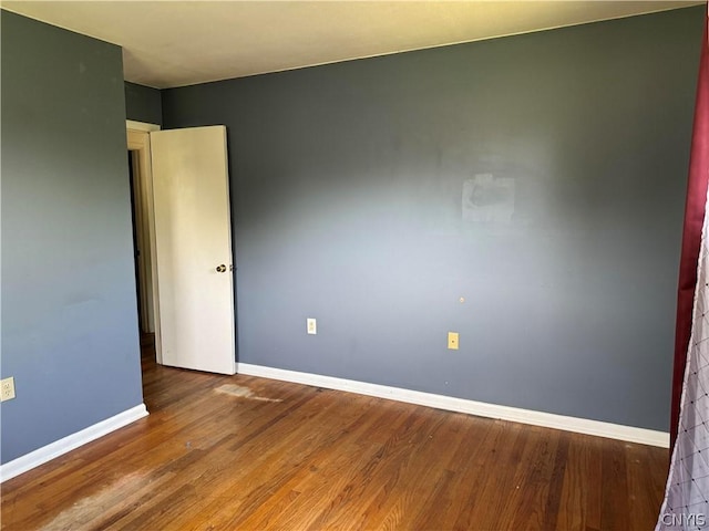 unfurnished room featuring wood-type flooring