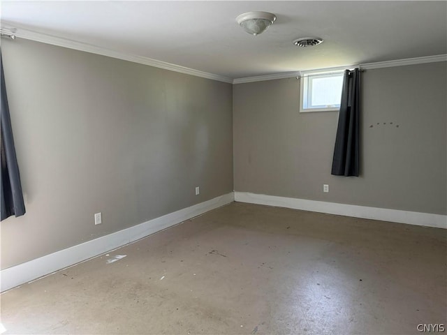 empty room with ornamental molding and concrete flooring