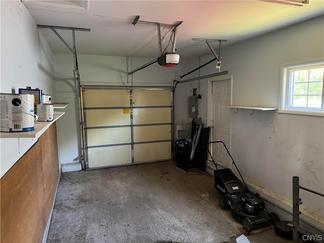 garage featuring a garage door opener and electric panel