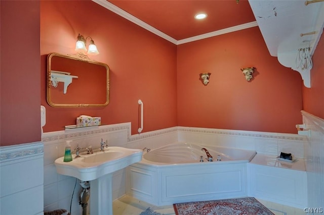 bathroom featuring crown molding, a bath, and sink