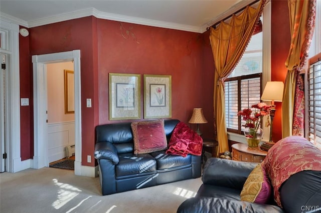 living room with crown molding, a baseboard heating unit, and light colored carpet