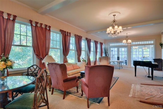 carpeted living room with an inviting chandelier, crown molding, french doors, and beamed ceiling