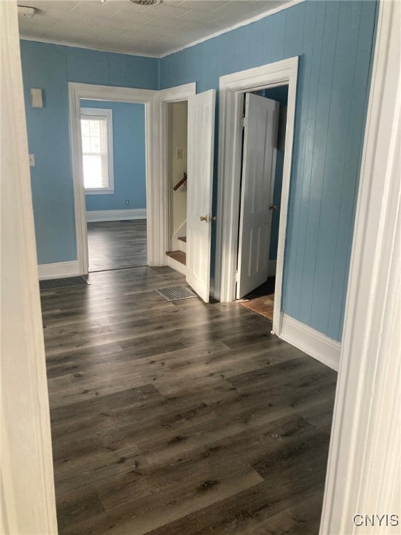 unfurnished room featuring dark hardwood / wood-style floors