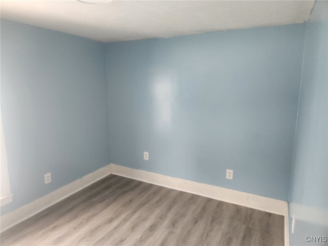 unfurnished room featuring wood-type flooring