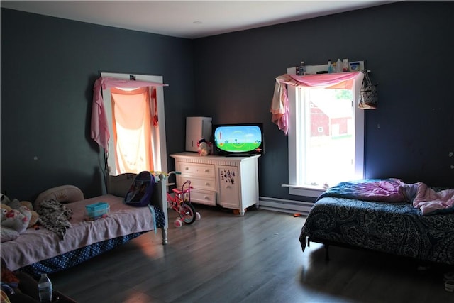 bedroom with hardwood / wood-style floors