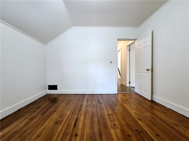 bonus room featuring dark hardwood / wood-style flooring and vaulted ceiling