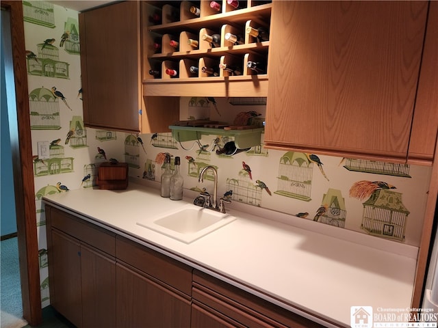 kitchen featuring sink and carpet floors