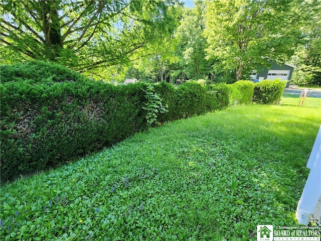 view of yard featuring a garage