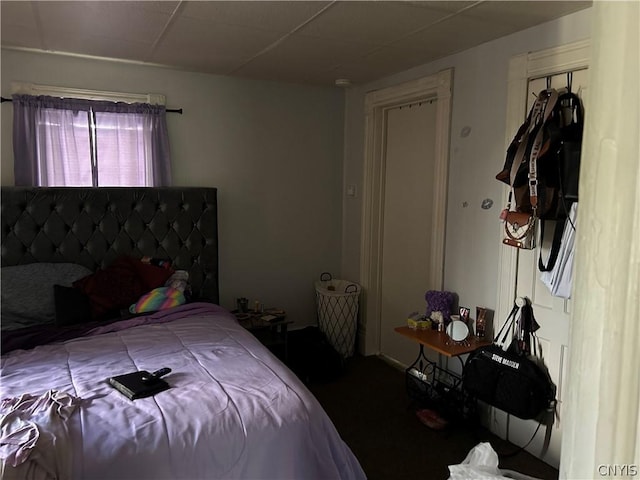 bedroom with a paneled ceiling