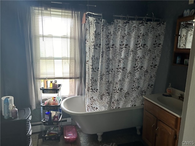 bathroom with vanity, a tub to relax in, and tile patterned floors