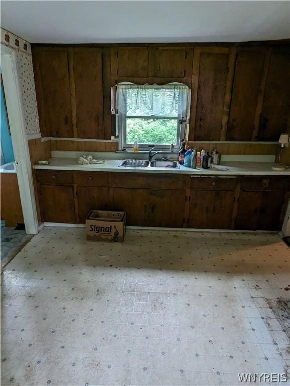 kitchen featuring sink and dark brown cabinetry