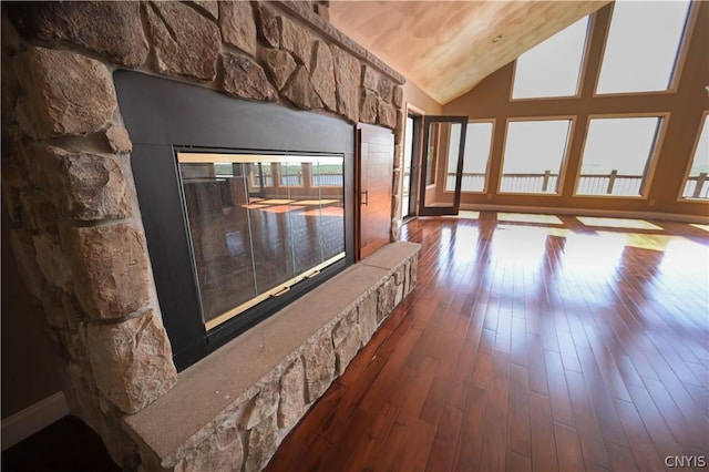 living room with dark hardwood / wood-style flooring and high vaulted ceiling