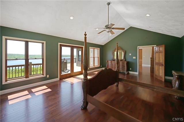 living room featuring ceiling fan, french doors, vaulted ceiling, a water view, and hardwood / wood-style flooring