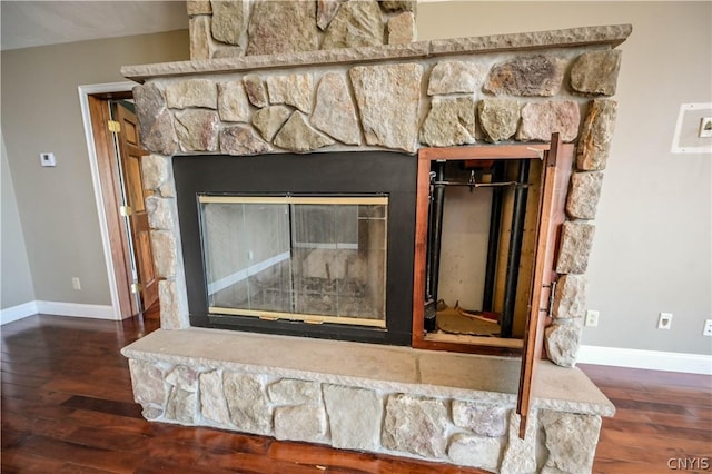 details featuring a fireplace and hardwood / wood-style flooring