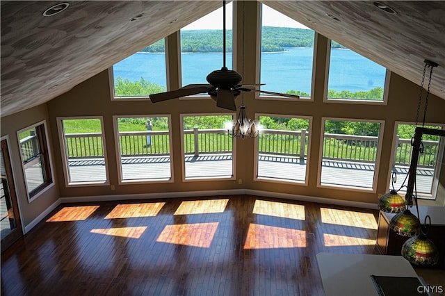 unfurnished sunroom featuring plenty of natural light, a water view, and vaulted ceiling