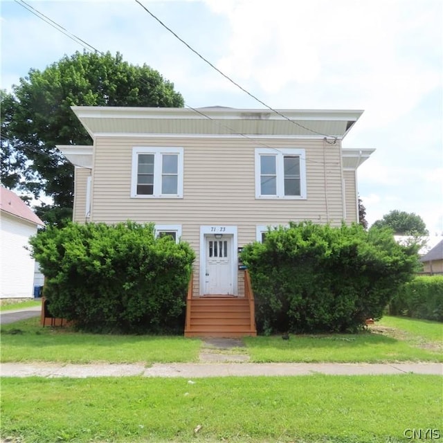 view of front facade with a front yard