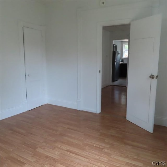 spare room featuring light hardwood / wood-style flooring