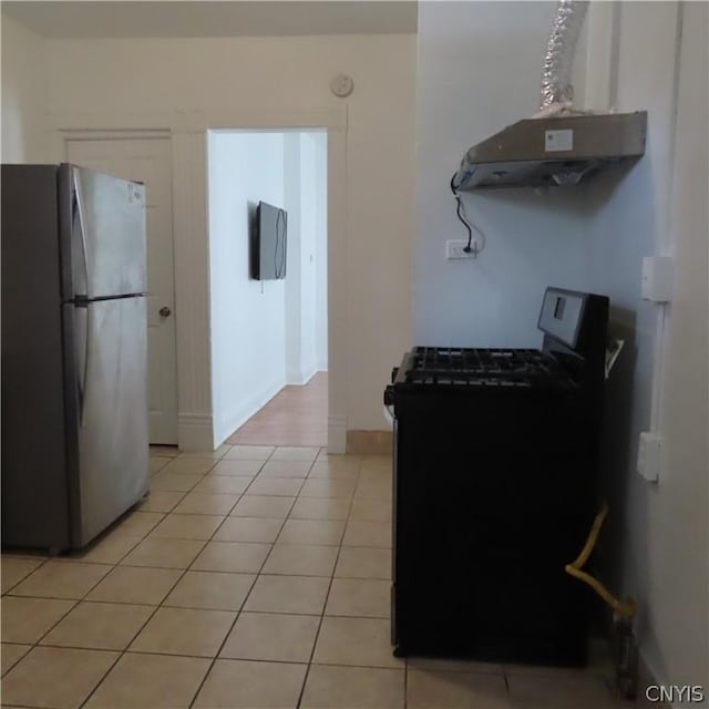 kitchen featuring stainless steel fridge, ventilation hood, light tile patterned floors, and black stove